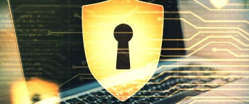 Cybersecurity shield protecting digital systems, illustrating what is GRC and the role of IT auditing and GRC.